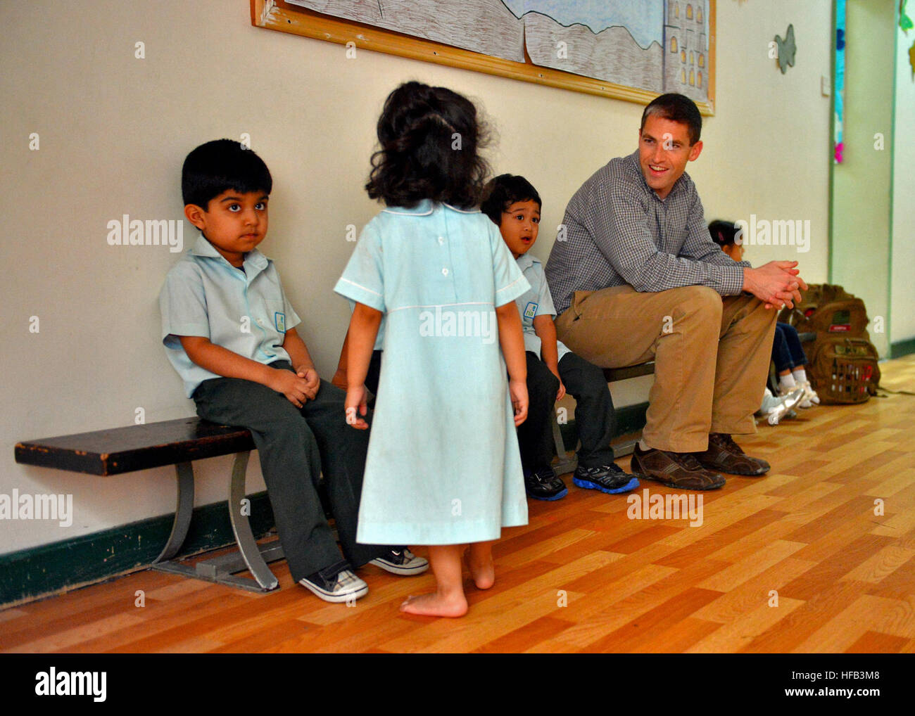 Task Force 56 A U.S. Navy officer assigned to Task Force 56 engages with children ...