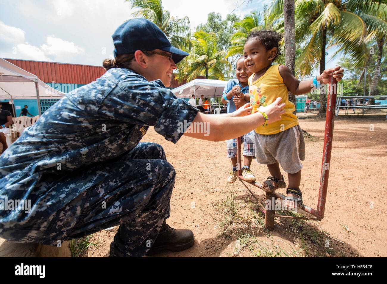 150521-N-PD309-128 PUERTO CABEZAS, Nicaragua (May 21, 2015) Lt. Cmdr. Heather Shattuck, assigned to Fort Belvoir Community Hospital, Va., plays with children at a medical site established at the Colegio Moravo Juan Amos Comenius during Continuing Promise 2015. Continuing Promise is a U.S. Southern Command-sponsored and U.S. Naval Forces Southern Command/U.S. 4th Fleet-conducted deployment to conduct civil-military operations including humanitarian-civil assistance, subject matter expert exchanges, medical, dental, veterinary and engineering support and disaster response to partner nations and  Stock Photo