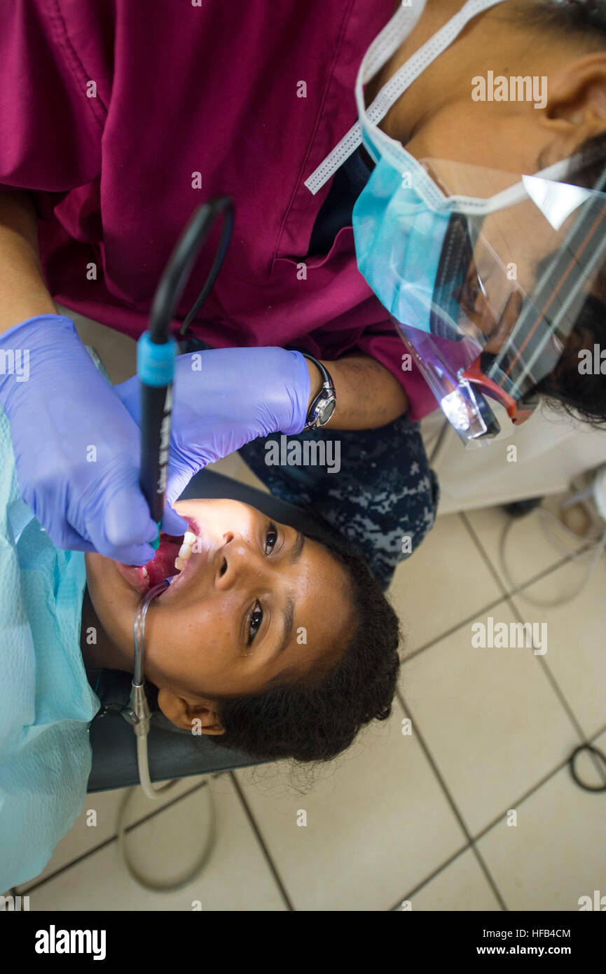 150521-N-XQ474-150 PUERTO CABEZAS, Nicaragua (May 21, 2015) Chief Hospital Corpsman Janae Smart, a native of Norfolk, Va., assigned to Naval Air Station Oceana Branch Health Clinic, Virginia Beach, Va., performs a dental cleaning on a patient at a medical site established at the Instituto Politechnico Heroes y Martires during Continuing Promise 2015. Continuing Promise is a U.S. Southern Command-sponsored and U.S. Naval Forces Southern Command/U.S. 4th Fleet-conducted deployment to conduct civil-military operations including humanitarian-civil assistance, subject matter expert exchanges, medic Stock Photo