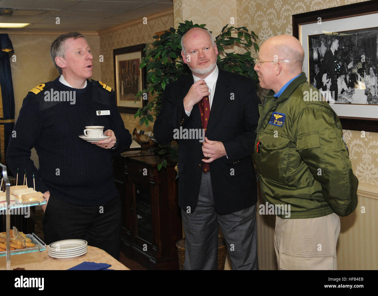 U.S. Navy Capt. Chip Miller, right, the commanding officer of the USS