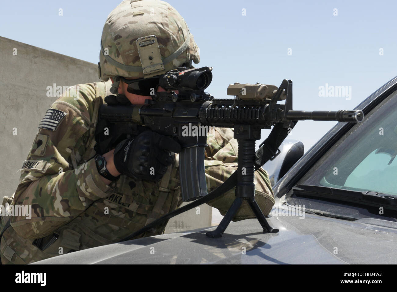Spc. Leonard Markley scans the horizon for threats serving in a security detail during a press visit at Kabul Military Training Compound in Kabul. (Official U.S. Navy photo by Lt. Russell Wolfkiel) 110514-N-JH188-034 (5722142596) Stock Photo