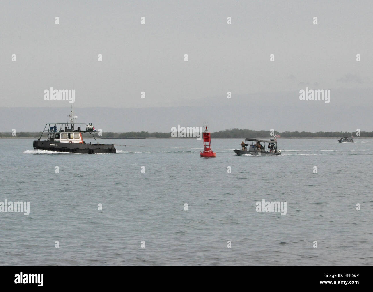 Two U.S. Coast Guard harbor patrol boats attached to Joint Task Force