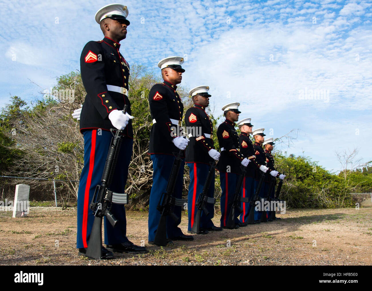 U.S. Marines assigned to a ceremonial firing squad at Naval Station Guantanamo Bay stand by during a Memorial Day ceremony at Cuzco Cemetery in Cuba, May 26, 2014. Cuzco Cemetery, normally closed to the public, is opened to base residents once a year for Memorial Day. (U.S. Navy photo by Mass Communication Specialist 2nd Class Scott Pittman/Released) Cuzco Cemetery ceremony 140526-N-FI736-004 Stock Photo