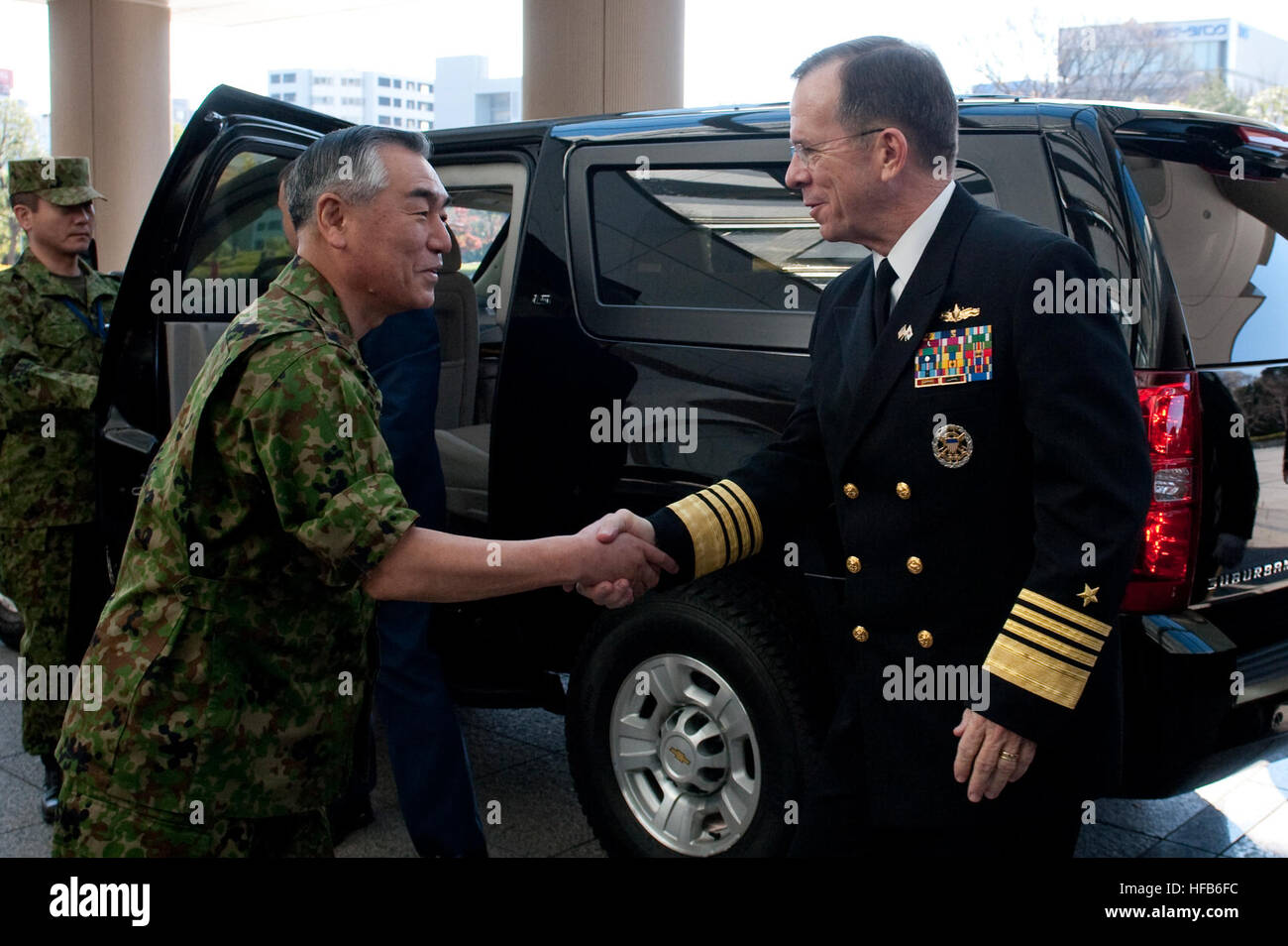 101209-N-0696M-103       Chairman of Japan's Joint Chiefs of Staff Gen. Ryoichi Oriki greets Chairman of the Joint Chiefs of Staff Adm. Mike Mullen in Tokyo, Japan, on Dec. 9, 2010.  Mullen traveled to Japan to meet with defense officials there reassuring the strength of the U.S.-South Korean alliance amid escalating tensions on the Korean Peninsula.  DoD photo by Petty Officer 1st Class Chad J. McNeeley, U.S. Navy.  (Released) Defense.gov News Photo 101209-N-0696M-103 - Chairman of Japan s Joint Chiefs of Staff Gen. Ryoichi Oriki greets Chairman of the Joint Chiefs of Staff Adm. Mike Mullen i Stock Photo