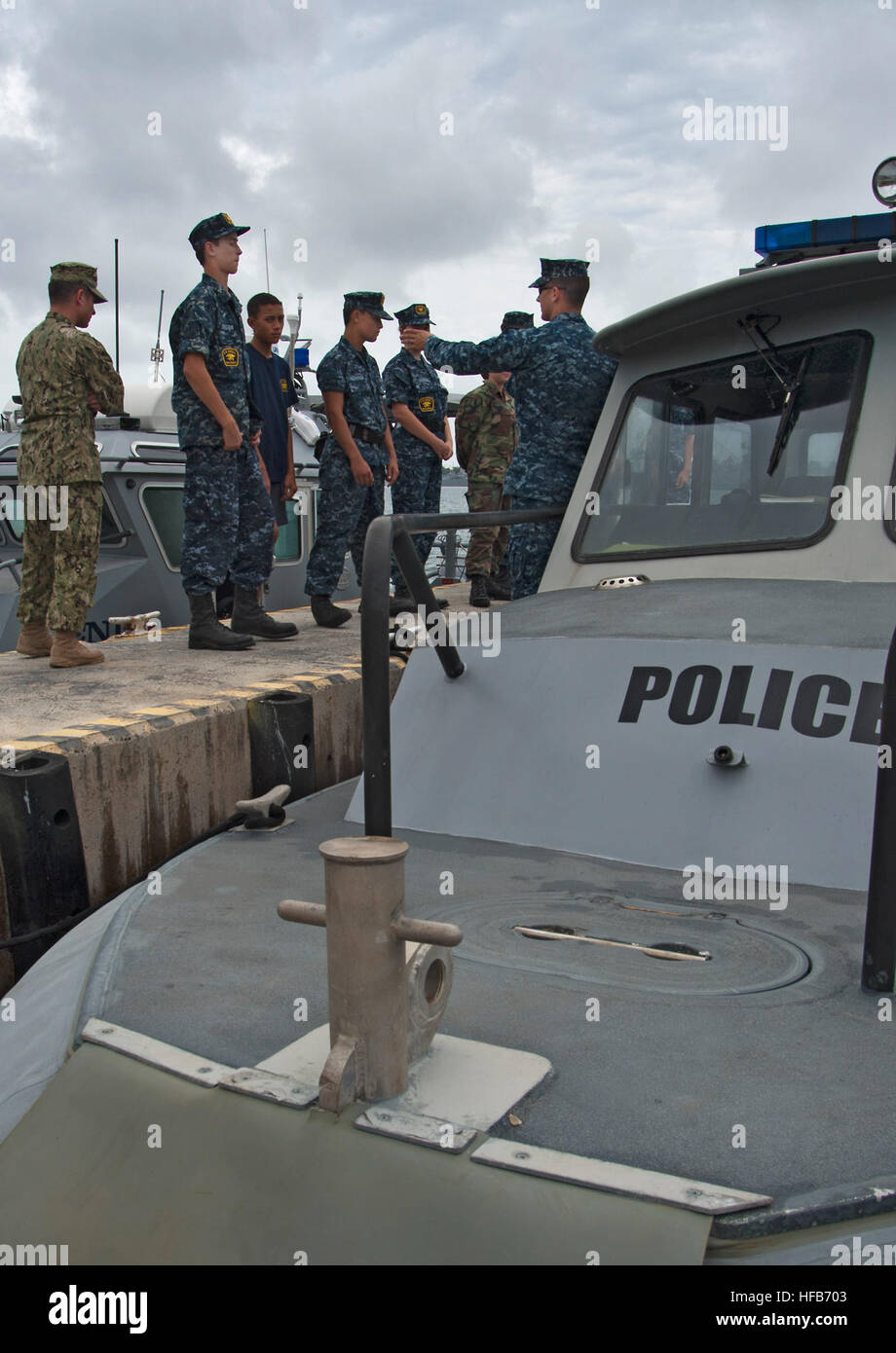 U.S. Navy MasteratArms 1st Class Paul Mobley, right, with a harbor