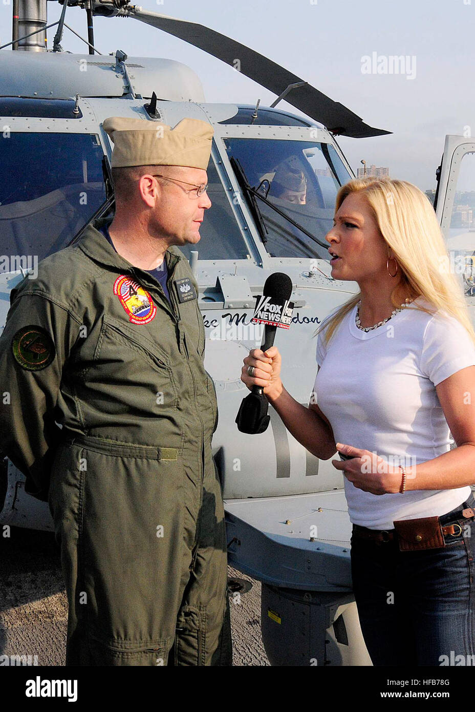 120526-N-YY933-071 NEW YORK (may 26, 2012) -- Senior Chief Operations Specialist (SW/AW) Andy Sutter from Assault Craft Unit 4 talks with Fox and Friends News Reporter Anna Kooiman in a live interview on the flight deck of the amphibious assault ship USS Wasp (LHD 1) during Fleet Week New York.This marks the 25th year the city has celebrated the nation's sea services for the citizens of New York and the tri-state area. This year, the seven-day event, coincides with the commemoration of the Bicentennial of the War of 1812, with more than 6,000 service members from the Navy, Marine Corps and Coa Stock Photo