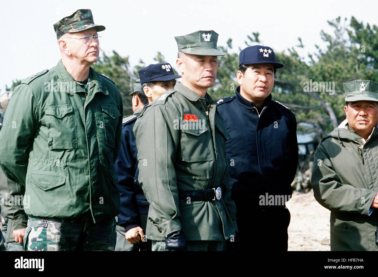 GEN Joseph J. Went and several Republic of Korea Marine and Navy officers observe joint salvage operations being performed on a stranded tank landing ship.  The ship ran aground during Exercise Team Spirit '83. DM-ST-83-08410 Stock Photo