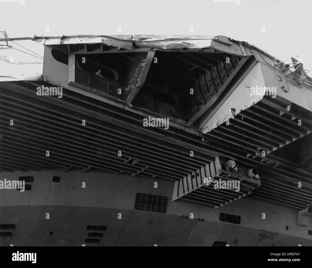 A view of damage sustained by the aircraft carrier USS JOHN F. KENNEDY (CV-67) when it collided with the guided missile cruiser USS BELKNAP (CG-26) during night operations on Nov. 22, 1975. DN-SN-87-07332 USS John F. Kennedy damaged front end of angled deck Stock Photo
