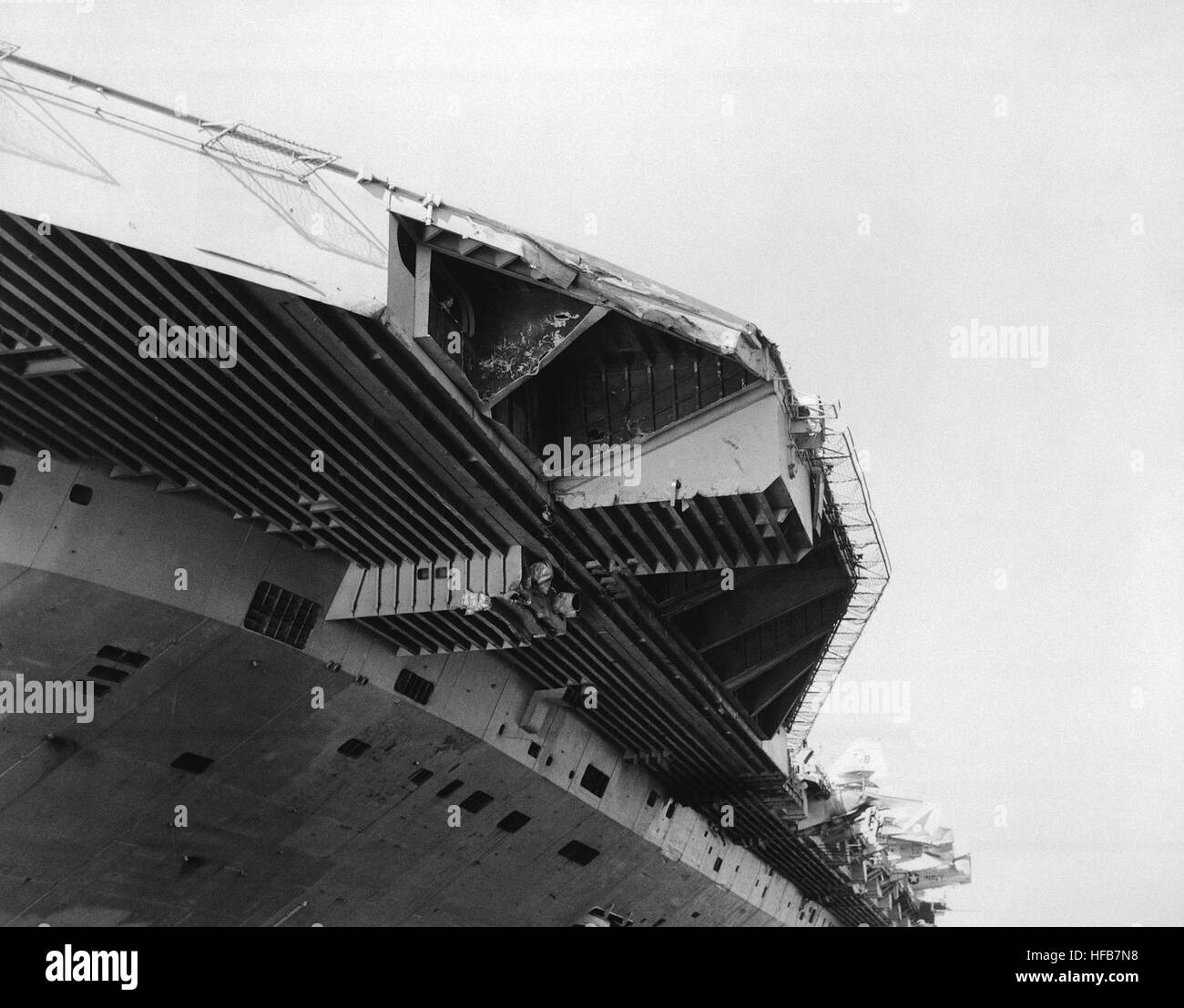A view of damage sustained by the aircraft carrier USS JOHN F. KENNEDY (CV 67) when it collided with the guided missile cruiser USS BELKNAP (CG 26) during night operations on November 22, 1975. DN-SN-87-07333 USS John F. Kennedy damaged front end of angled deck Stock Photo
