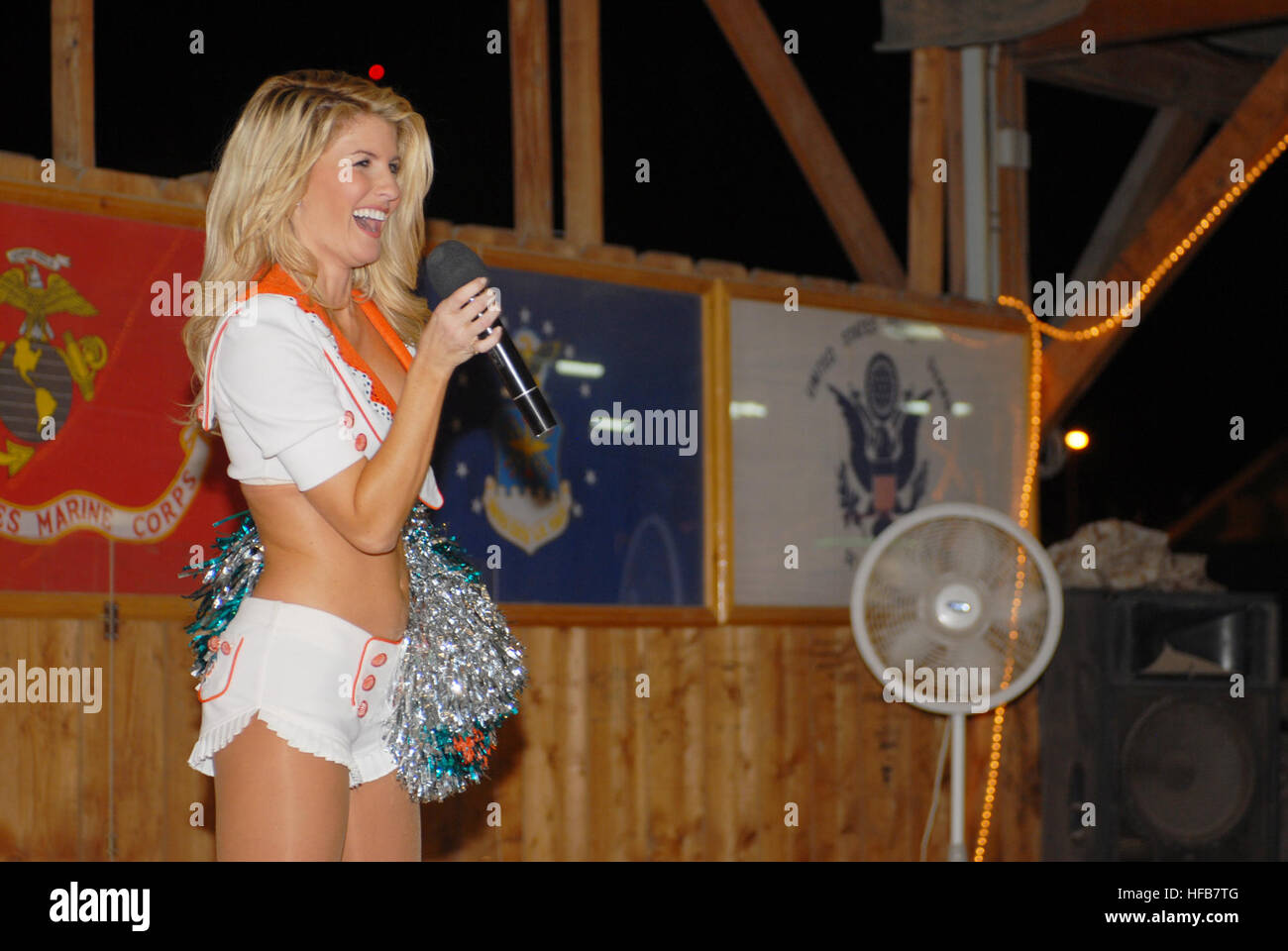 Miami Dolphins' cheerleaders entertained Soldiers, Sailors, Marines and Airmen on a tour of the area. They performed a few dance routines and signed autographs for the troops. Dolphins cheerleaders Djibouti 10 Stock Photo