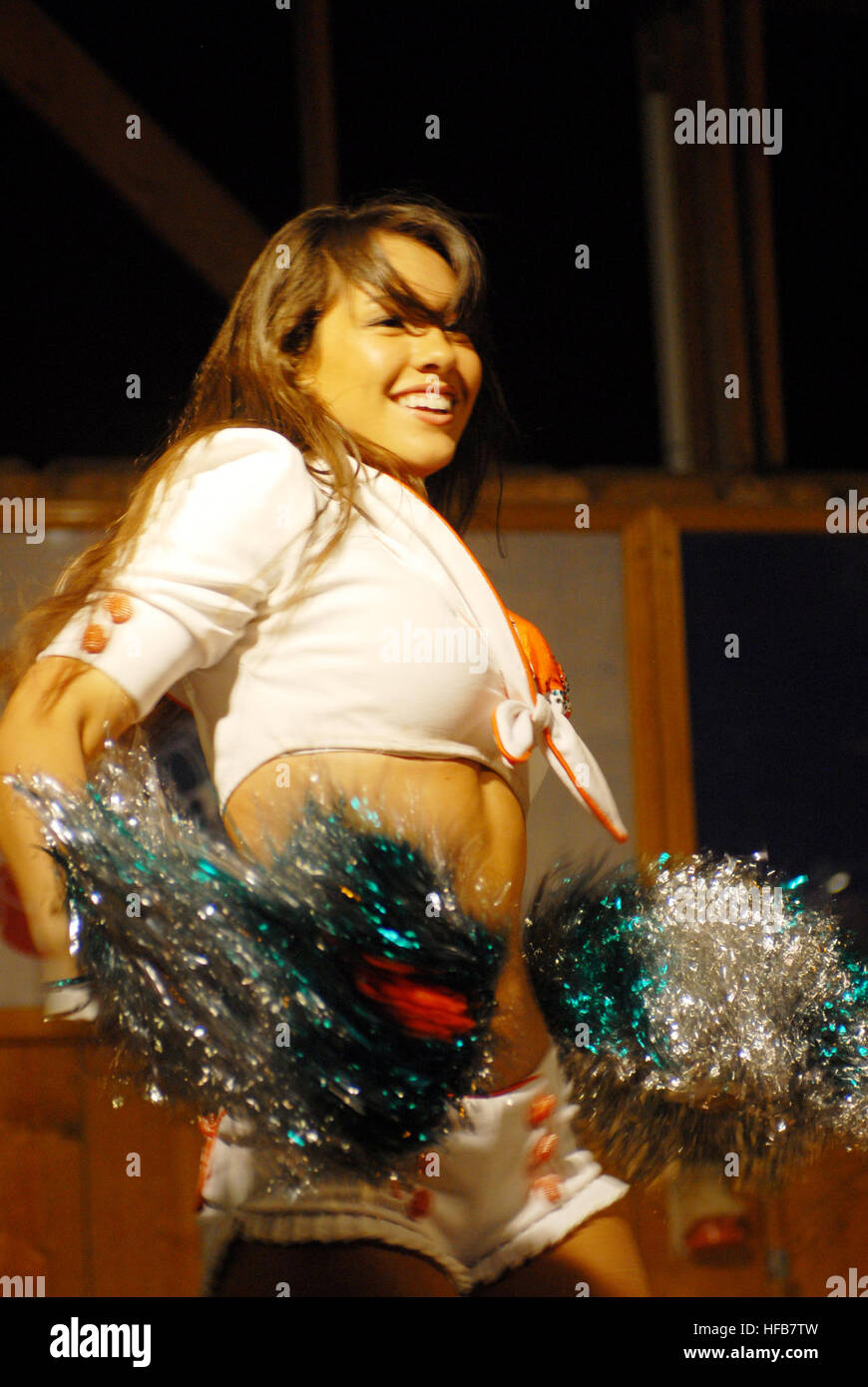 Miami Dolphins' cheerleaders entertained Soldiers, Sailors, Marines and Airmen on a tour of the area. They performed a few dance routines and signed autographs for the troops. Dolphins cheerleaders Djibouti 9 Stock Photo