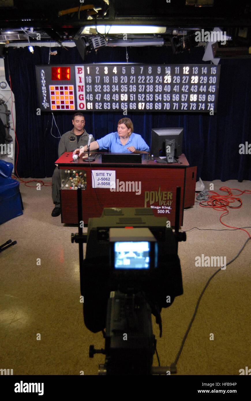 Sara Dowell, Morale, Welfare and Recreation director, also known as "Fun  Boss," hosts weekly bingo with Naval Air Crewman 1st Class John Frietze in  the TV Studio aboard USS Dwight D. Eisenhower.