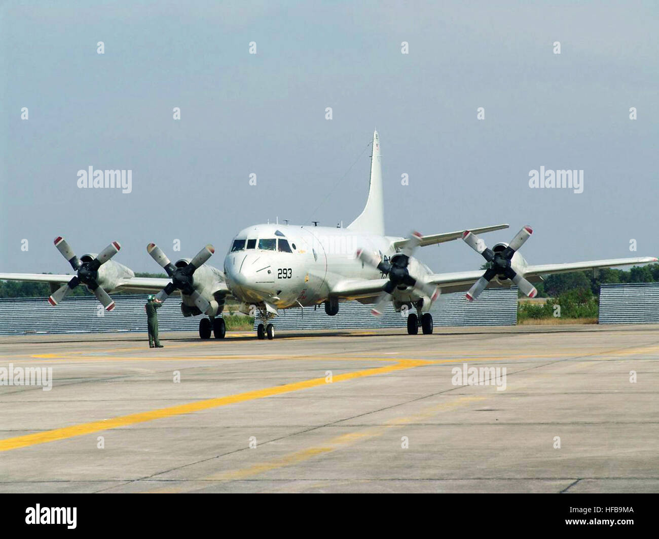 A US Navy (USN) EP-3C Orion surveillance aircraft assigned to the 'Tigers' of Patrol Squadron 8 (VP-8) is marshaled into position after arriving at Utapoa, Royal Thai Air Force Base (RTAFB), Thailand. The aircraft and its crew members are deployed to Thailand to conduct survey operations in support of disaster relief after a Tsunami hit coastal regions throughout Southeast Asia. EP-3C VP-8 U-Tapao Dec2004 Stock Photo
