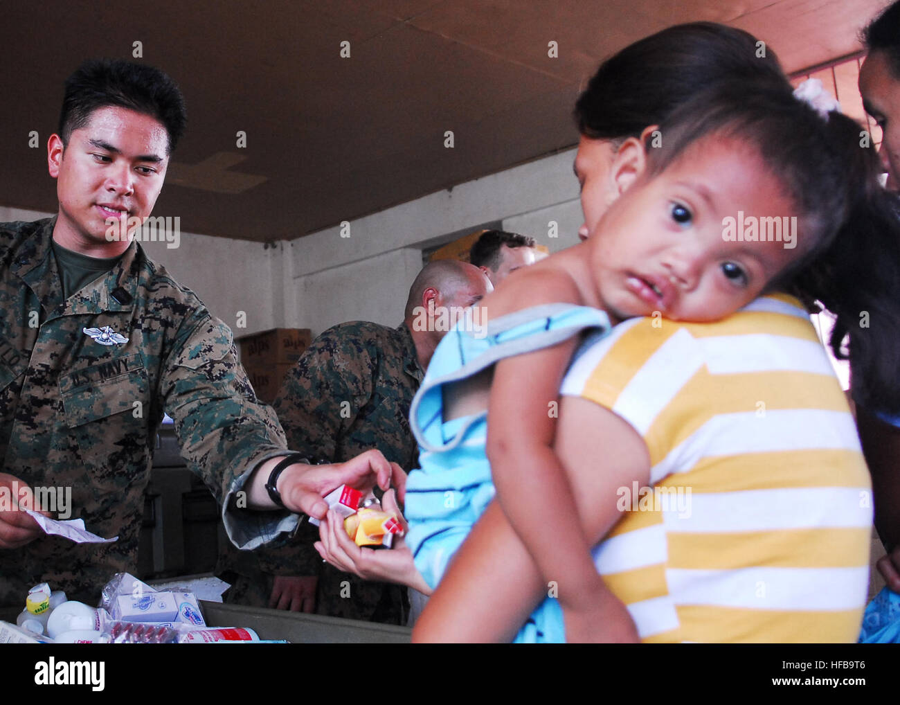 Petty Officer 2nd Class Joseph Castillo, hospital corpsman, from Combat Logistics Battalion Health Service Support Team, 31st Marine Expeditionary Unit, hands out medication during a medical civil action project at San Juan Elementary School. The 31st MEU is operating with the forward-deployed Essex Amphibious Ready Group as part of Balikatan 2010, an annual, bilateral exercise designed to improve interoperability between the U.S. and Republic of the Philippines. Essex ARG Dental Civil Action Project with the Armed Forces of the Philippines 258418 Stock Photo
