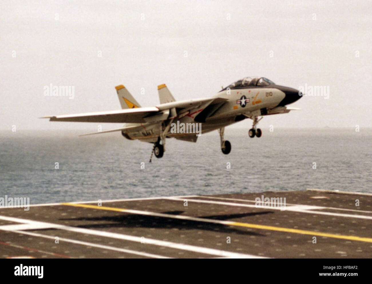F-14A Tomcat fighter aircraft of VF-21 lands on the flight deck of USS ...