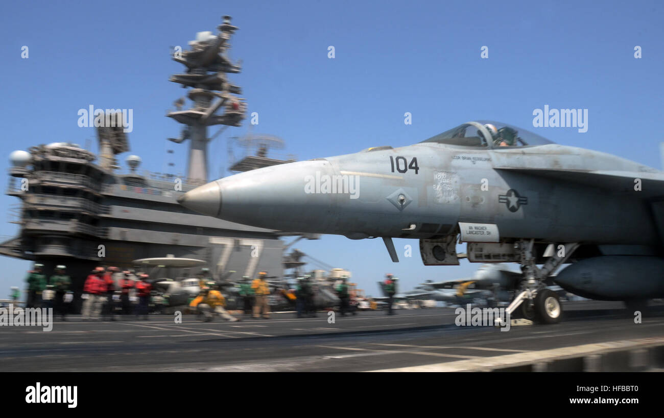 A U.S. Navy F/A-18E Super Hornet aircraft assigned to Strike Fighter Squadron (VFA) 31 launches from the flight deck of the aircraft carrier USS George H.W. Bush (CVN 77) July 22, 2014, in the Persian Gulf. The George H.W. Bush was supporting maritime security operations and theater security cooperation efforts in the U.S. 5th Fleet area of responsibility. (U.S. Navy photo by Mass Communication Specialist 3rd Class Ryan Seelbach/Released) F-A-18E Super Hornet launch 140722-N-XI307-231 Stock Photo