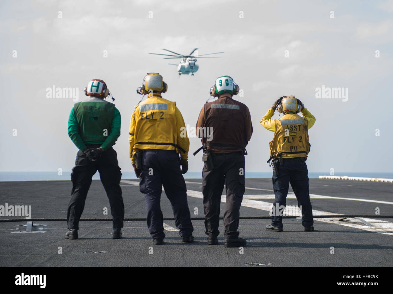 160329-N-BR087-052  PHILIPPINE SEA (March 29, 2016) A Japanese Maritime Self-Defense Force (JMSDF) H-53 helicopter approaches USS John C. Stennis' (CVN 74) flight deck to transfer JMSDF naval liaison officers. Providing a ready force supporting security and stability in the Indo-Asia-Pacific, John C. Stennis is operating as part of the Great Green Fleet on a regularly scheduled 7th Fleet deployment. (U.S. Navy photo by Mass Communication Specialist Seaman Cole C. Pielop/Released) 160329-N-BR087-052 160329-N-BR087-052 Stock Photo