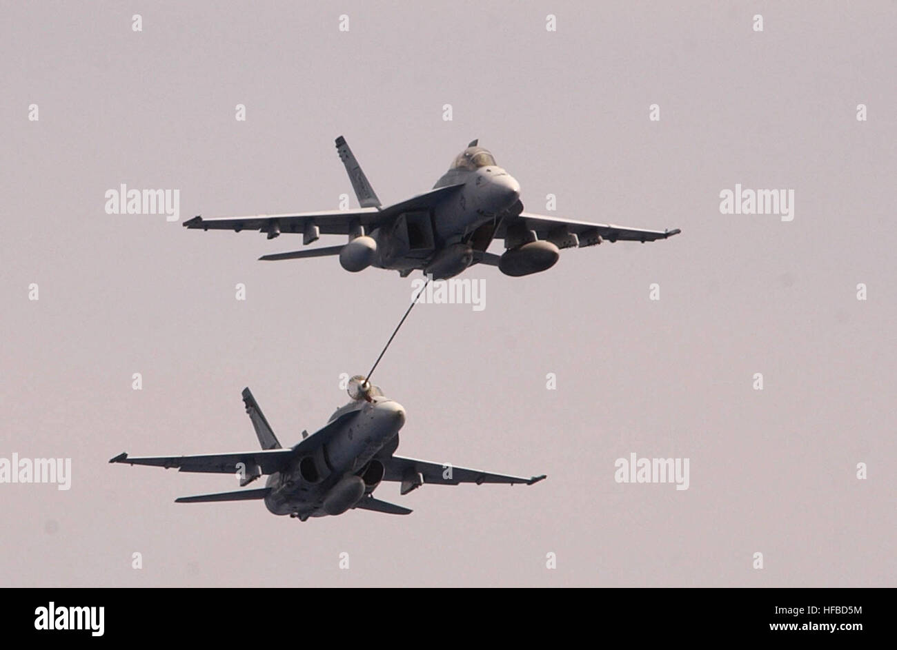 An F A 18E F Super Hornet And An F A 18F Hornet Perform Air to air an-f-a-18e-f-super-hornet-and-an-f-a-18f-hornet-perform-air-to-air