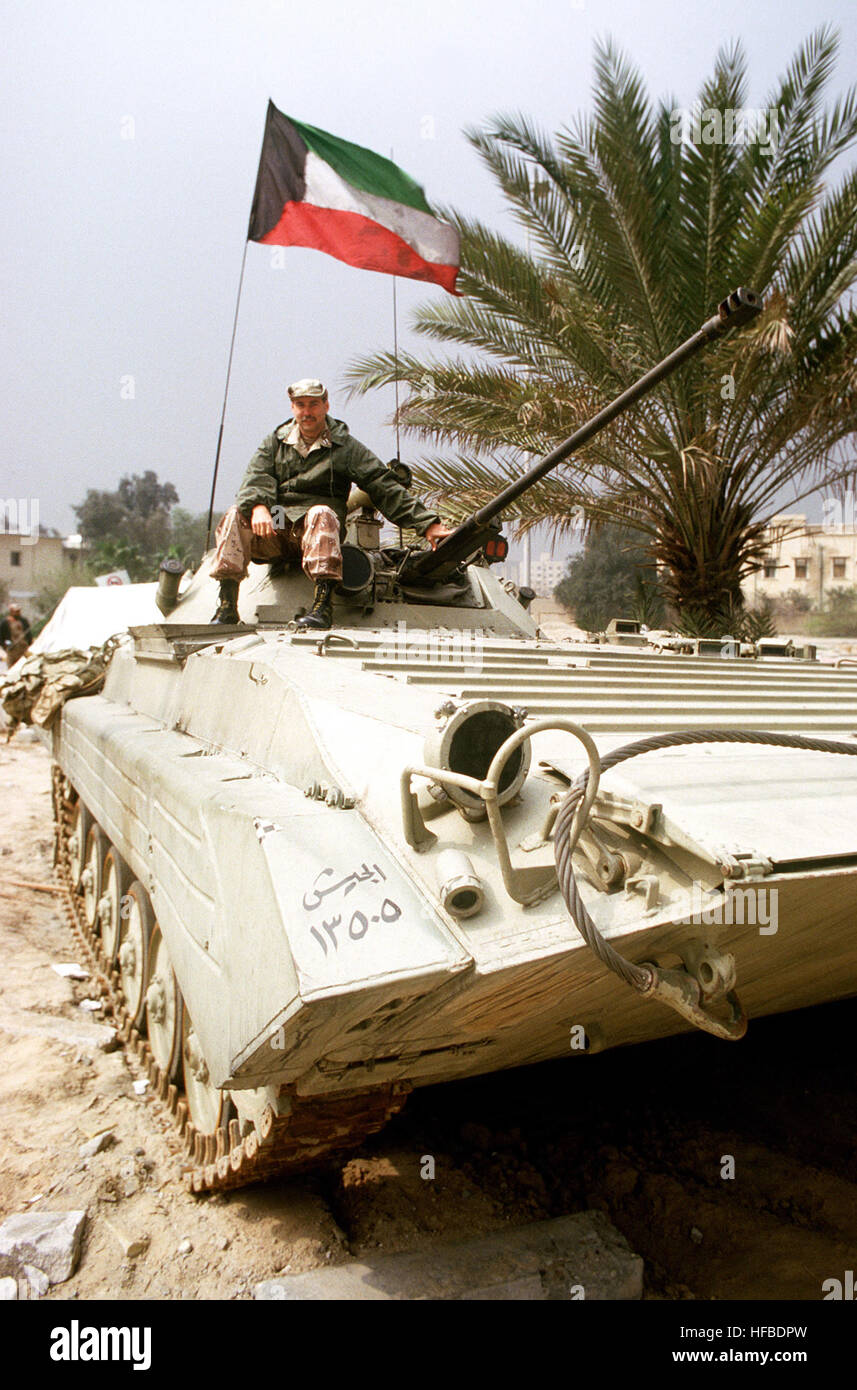 Lt. David Culler, a public affairs officer with the Joint Information Bureau, sits atop a captured Iraqi BMP-2 infantry fighting vehicle during the cease fire concluding Operation Desert Storm. File-Kuwaiti BMP-2 3 Stock Photo