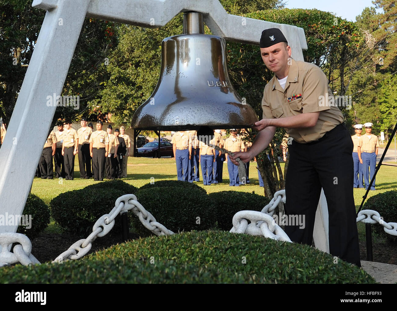 NAVAL AIR STATION MERIDIAN, Miss. (Oct. 12, 2012) Aviation Boatswain's Mate (Handling) 3rd Class David Neiman rings the bell of the attack cargo ship USS Yancey (AKA-93) in honor of the Navy's 237th birthday. The bell ringing serves as a reminder of history, heritage and accomplishments of the naval service, and it is an enduring tradition of the Navy birthday celebration. The U.S. Navy has a 237-year heritage of defending freedom and projecting and protecting U.S. interests around the globe. Join the conversation on social media using #warfighting. (U.S. Navy photo by Mass Communication Speci Stock Photo