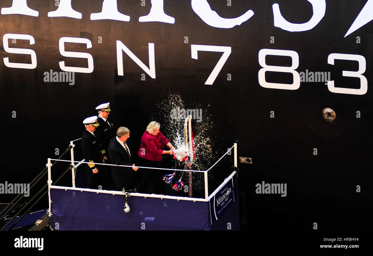 NEWPORT NEWS, Va. (Oct. 27, 2012) Ellen Roughead, wife of former Chief of Naval Operations (CNO) Adm. Gary Roughead and sponsor of the Virginia-class attack submarine Pre-Commissioning Unit (PCU) Minnesota (SSN 783), breaks a bottle to christen the boat. Minnesota is the tenth Virginia-class submarine and the third U.S. Navy ship to bear the name of the 32nd state. America’s Sailors are Warfighters, a fast and flexible force deployed worldwide. Join the conversation on social media using #warfighting. (U.S. Navy photo by Mass Communication Specialist 3rd Class Billy Ho/Released) 121027-N-QL471 Stock Photo