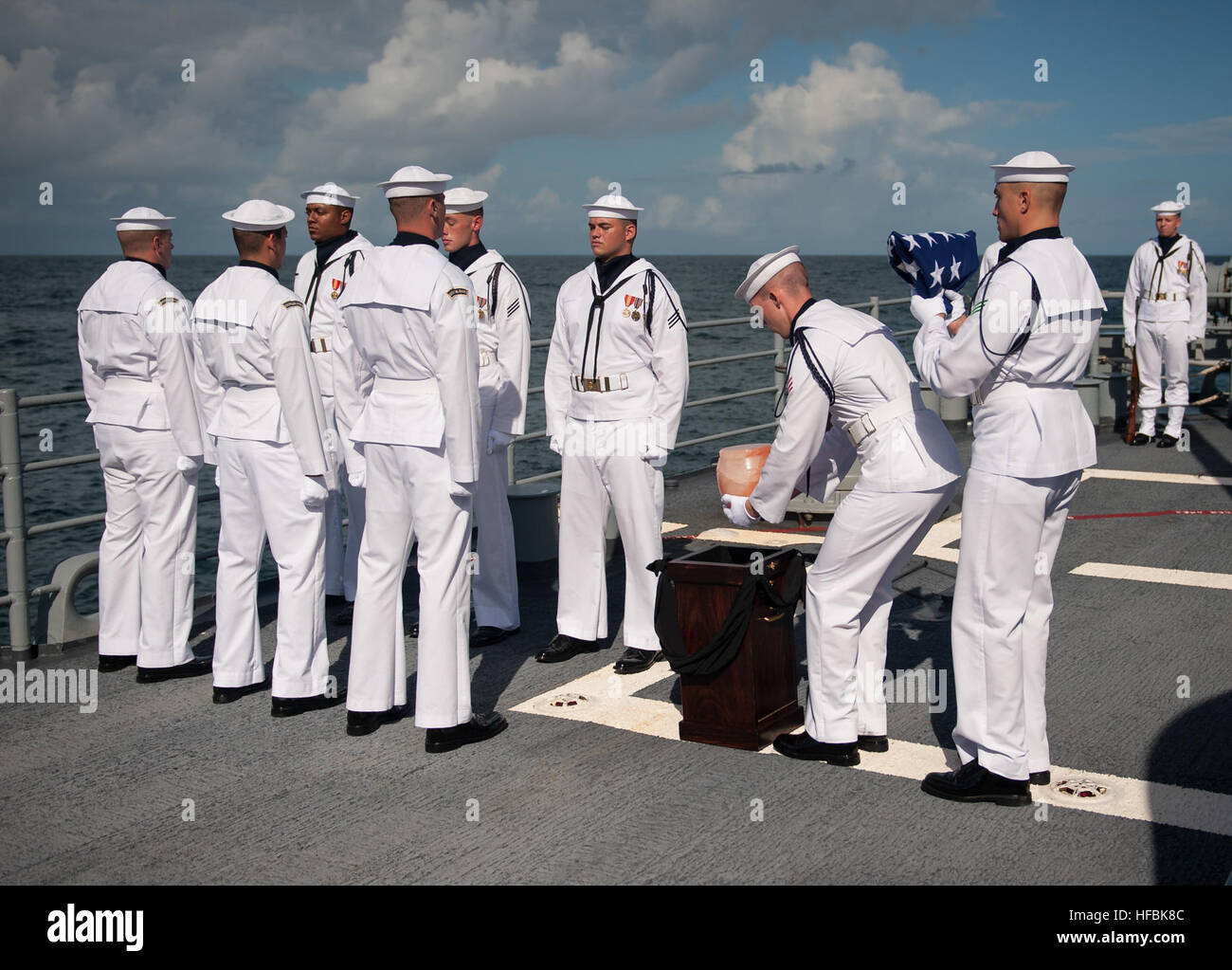 ATLANTIC OCEAN (Sept. 14, 2012)  Sailors carry the cremains of Apollo 11 astronaut Neil Armstrong during a burial at sea service aboard the guided-missile cruiser USS Philippine Sea (CG 58) in the Atlantic Ocean. Armstrong, the first man to walk on the moon during the 1969 Apollo 11 mission, died Saturday, Aug. 25. He was 82. (U.S. Navy photo courtesy of NASA by Bill Ingalls/Released) 120914-O-ZZ999-102 Join the conversation www.facebook.com/USNavy www.twitter.com/USNavy navylive.dodlive.mil  - Official U.S. Navy Imagery - Neil Armstrong buried at sea aboard USS Philippine Sea. Stock Photo