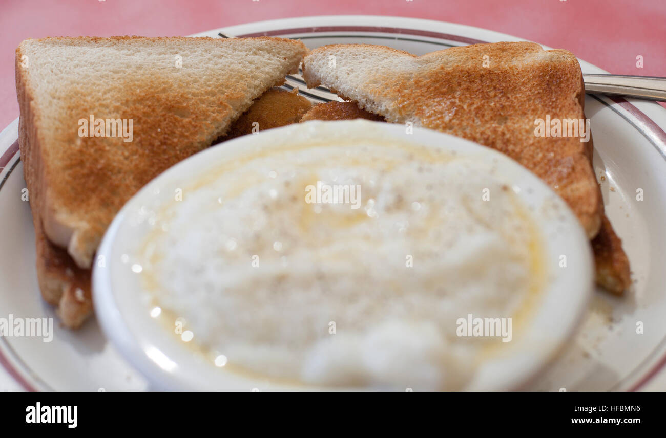 Breakfast plate of toast and grits Stock Photo Alamy