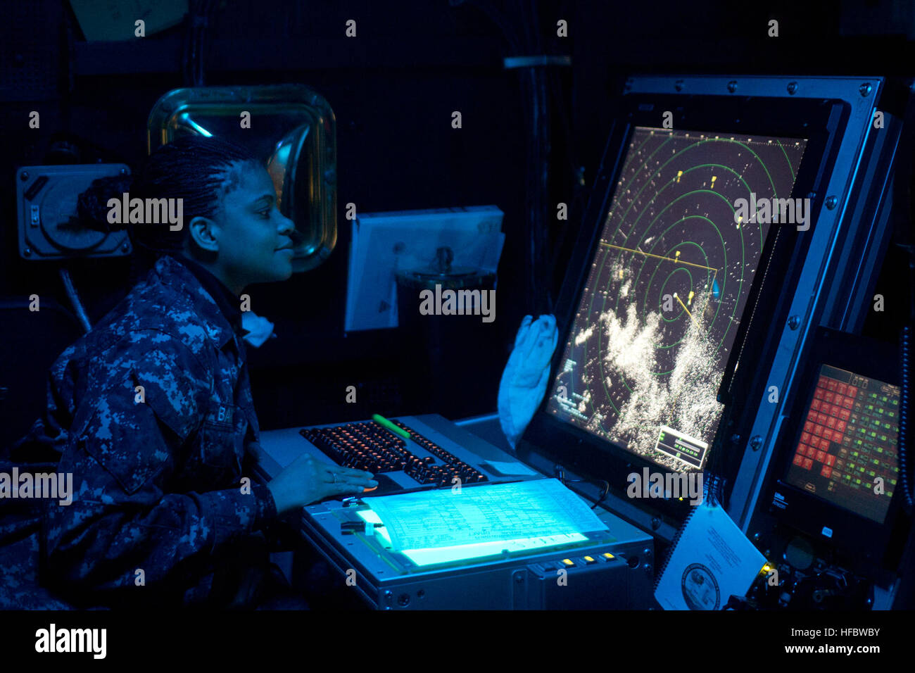 PACIFIC OCEAN (Sept. 18, 2012) Air Traffic Controller 3rd Class Nakivia Barnes, from Georgetown, Texas, monitors flight operations in the air traffic control center aboard the aircraft carrier USS George Washington (CVN 73). George Washington and its embarked air wing, Carrier Air Wing (CVW) 5, provide a combat-ready force that protects and defends the collective maritime interest of the U.S. and its allies and partners in the Asia-Pacific region. (U.S. Navy photo by Mass Communication Specialist 3rd Class William Pittman/Released) 120918-N-SF704-235 Join the conversation http://www.facebook.c Stock Photo