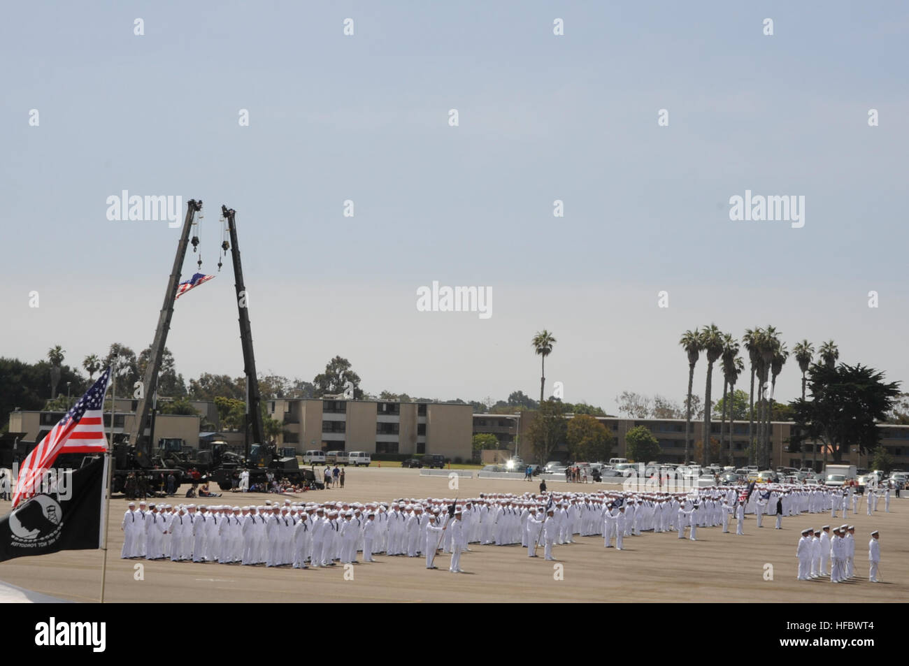 Seabees from Naval Mobile Construction Battalion 3, 5 and 40 stand in formation during Seabee Days, here on the Port Hueneme ceremonial grinder July 23. This was the 24th Seabee Days held in Port Hueneme since 1986 and is a two day celebration honoring the men and women of the Navy’s elite construction force. Seabees are an expeditionary element of U.S. Naval forces providing construction, engineering and security services in support of national strategy, naval power projection, humanitarian assistance and contingency operations. 2011 Seabees Days at Naval Base Ventura County 110723-N-Xz597-06 Stock Photo