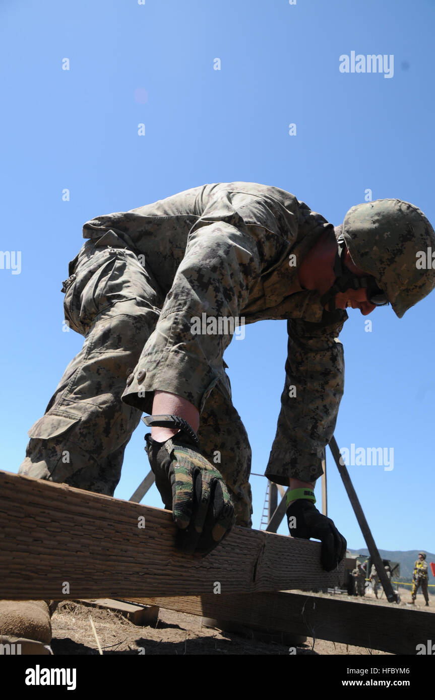 Builder 3rd Class Gary Lashley constructs the cross bracings for ...