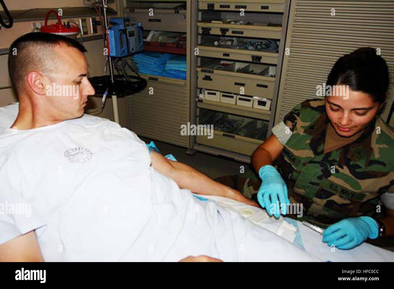 Giving an I.V. at U.S. Naval Hospital Guantanamo Bay emergency room ...
