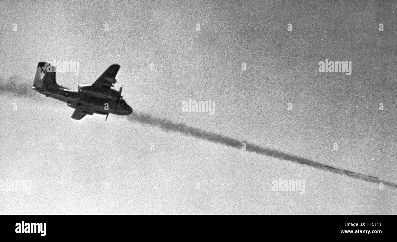 A Grumman S-2E Tracker aircraft from VS-38 launches rockets during ...