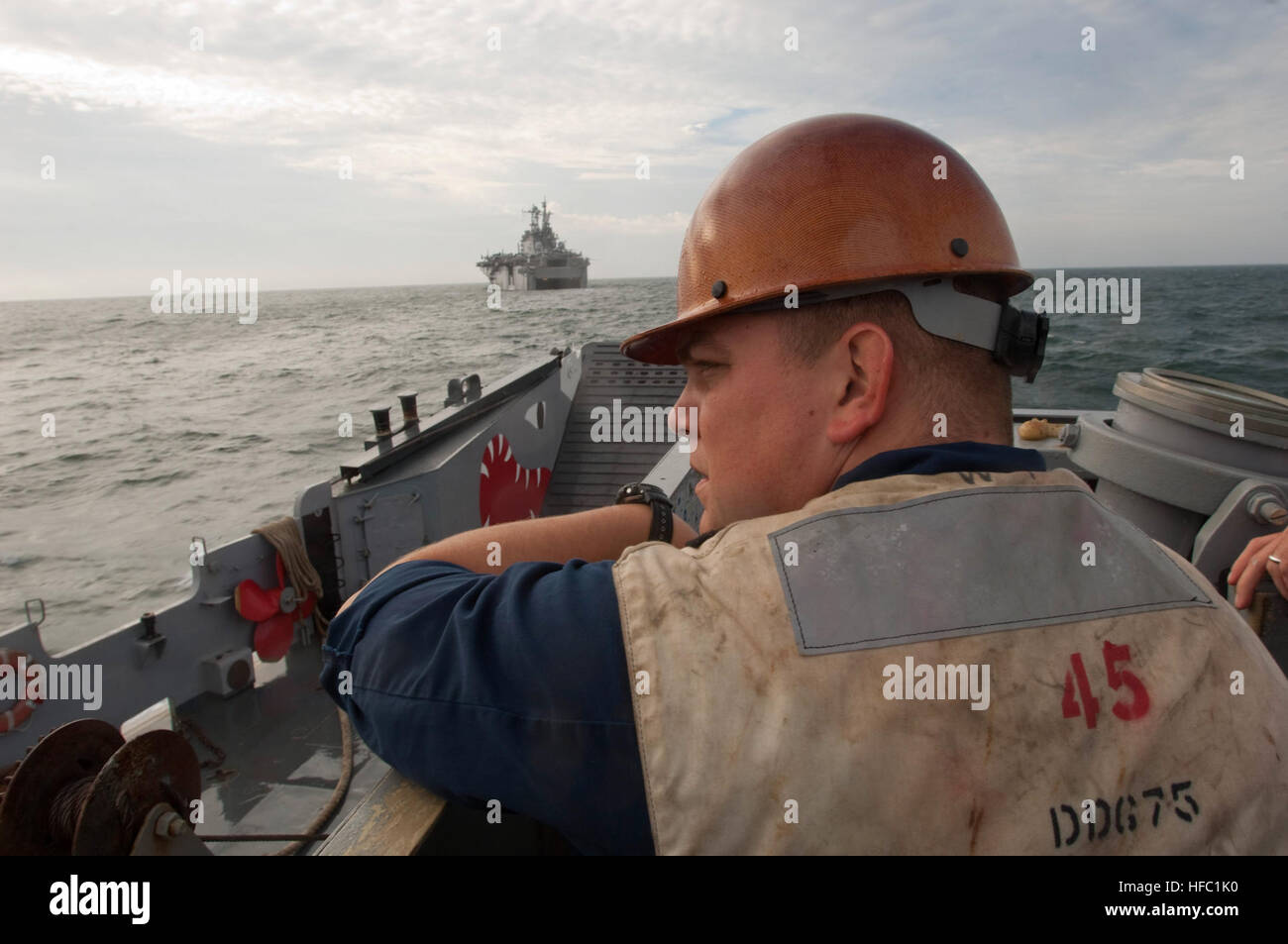 U.S. Navy Boatswain's Mate 1st Class Johnnie Lowery watches the tides