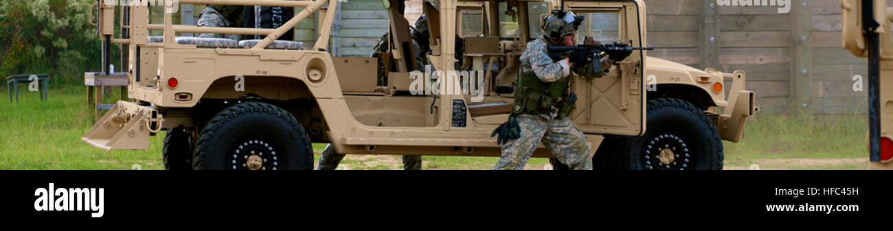 A Humvee equipped with mounted weaponry is used by military personnel ...