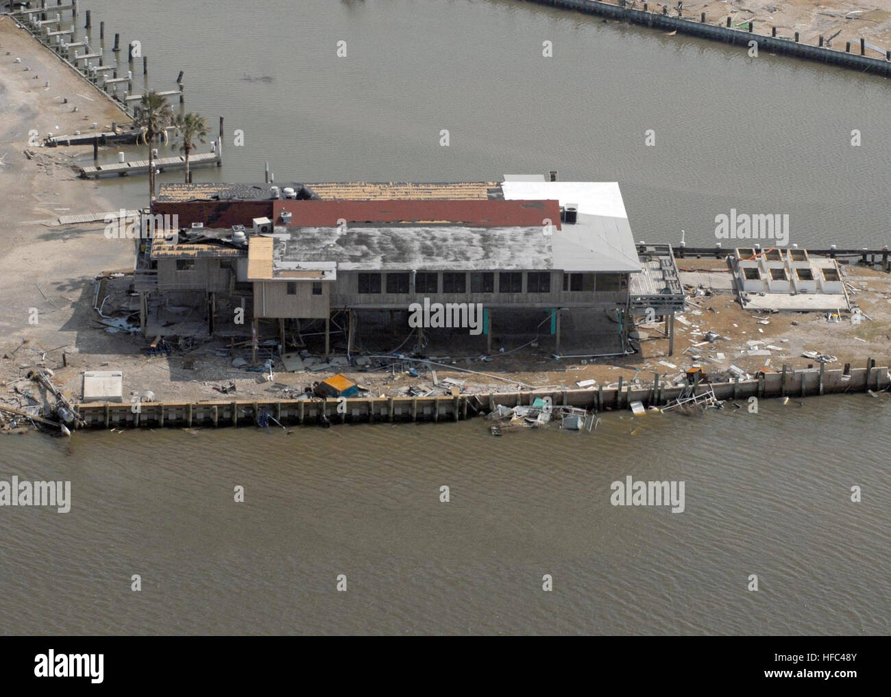 A damaged boathouse on the Bolivar Peninsula in Galveston, Texas, is visible in this aerial photograph. Hurricane Ike struck the Texas Gulf Coast as a strong Category 2 storm, Sept. 13, 2008, causing widespread damage to the region. Hurricane Ike Damage in Galveston, Texas 117353 Stock Photo