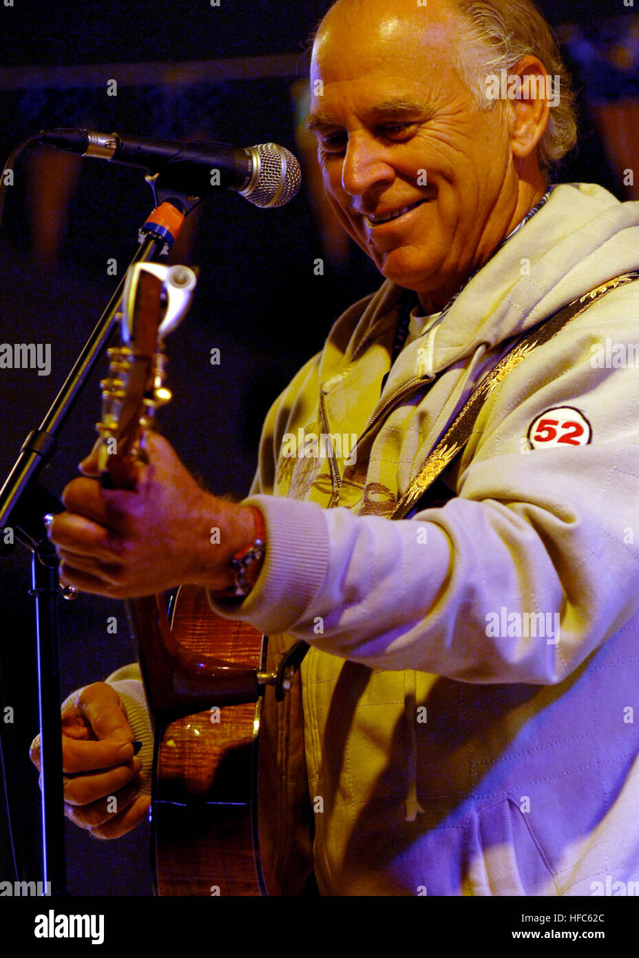 080128-N-3235P-209 MIDDLE EASTERN PORT (Jan. 28, 2008) Recording artist Jimmy Buffett performs a USO concert for the Sailors of the Nimitz-class aircraft carrier USS Harry S. Truman (CVN 75) during a recent port visit in the Middle East. Truman and embarked Carrier Air Wing (CVW) 3 are on a scheduled deployment supporting Operations Iraqi Freedom, Enduring Freedom and maritime security operations. U.S. Navy photo by Chief Mass Communication Specialist Michael W. Pendergrass (Released) Jimmy Buffet 2 Stock Photo