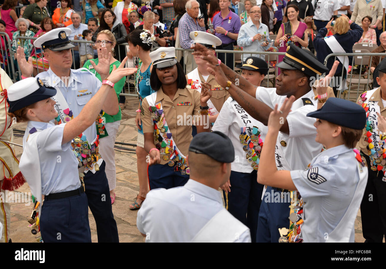 Military ambassadors dance during Fiesta Fiesta, the official kickoff event for the annual celebration Fiesta San Antonio, a 10-day long series of events honoring the defenders who fought in 'Battle of the Alamo' and the 'Battle of San Jacinto” in 1836, both important events that shaped the history of Texas and this country. Joint Base San Antonio military ambassadors join Fiesta royalty, special guests to kick off Fiesta San Antonio 150416-N-UR169-015 Stock Photo