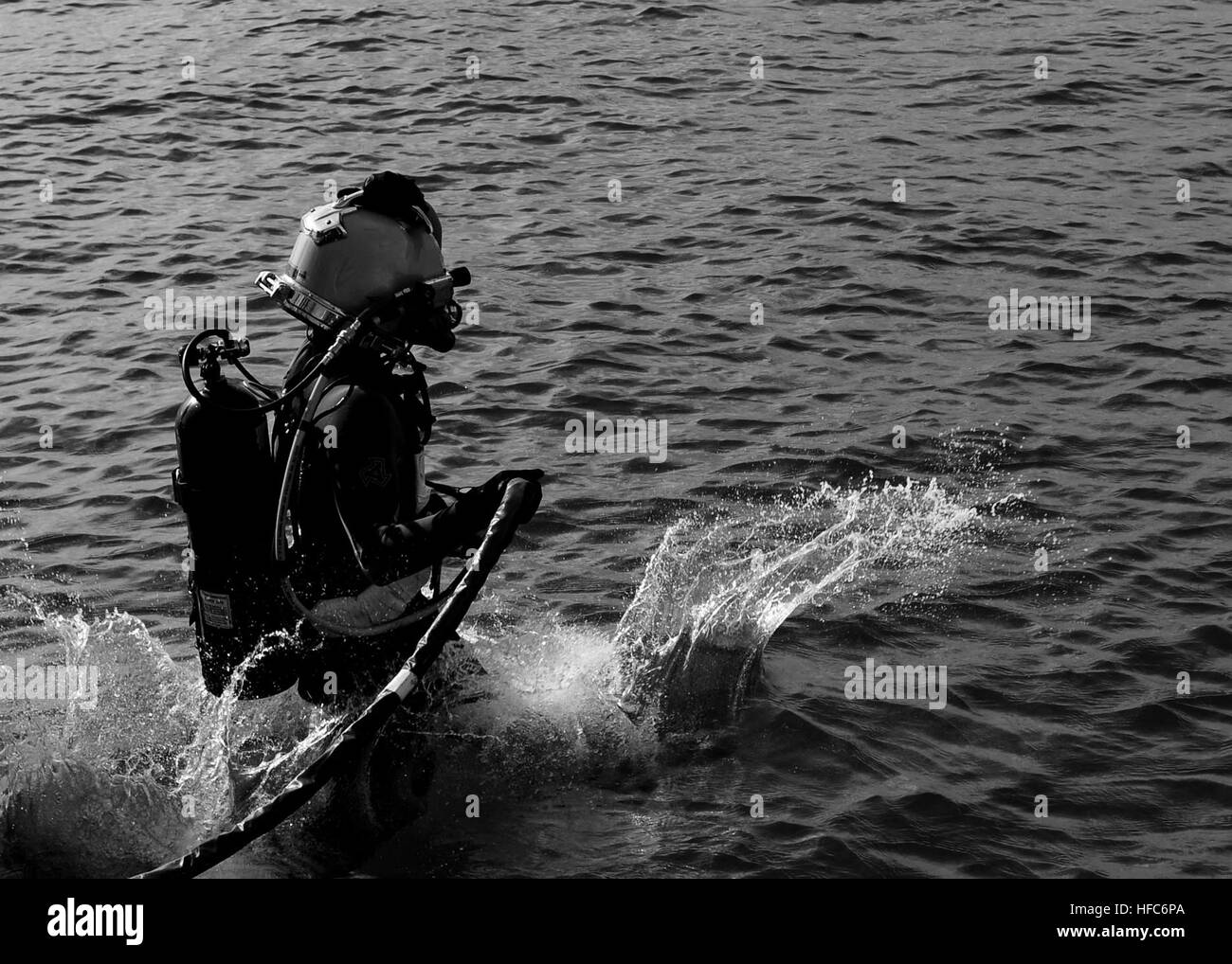 A diver assigned to Underwater Construction Team One (UCT ONE) enters