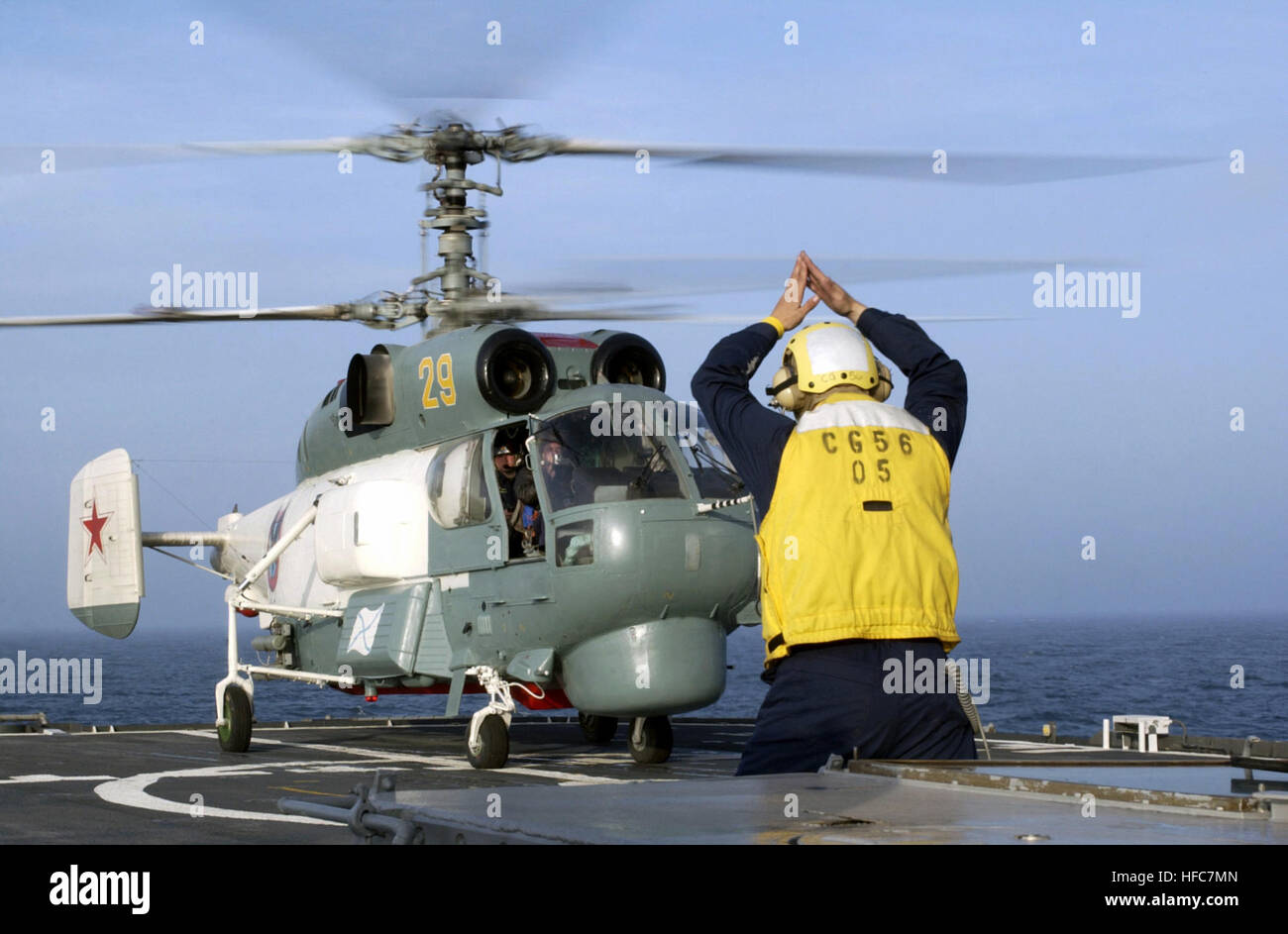 The Russian Kamov KA-27 Helix helicopter makes a successful safe landing on the Ticonderoga Class Cruiser USS SAN JACINTO (CG 56) flight deck, on the Baltic Sea, during the annual maritime Exercise BALTIC OPERATIONS 2003 (BALTOPS). Kamov KA-27 Helix helicopter Stock Photo