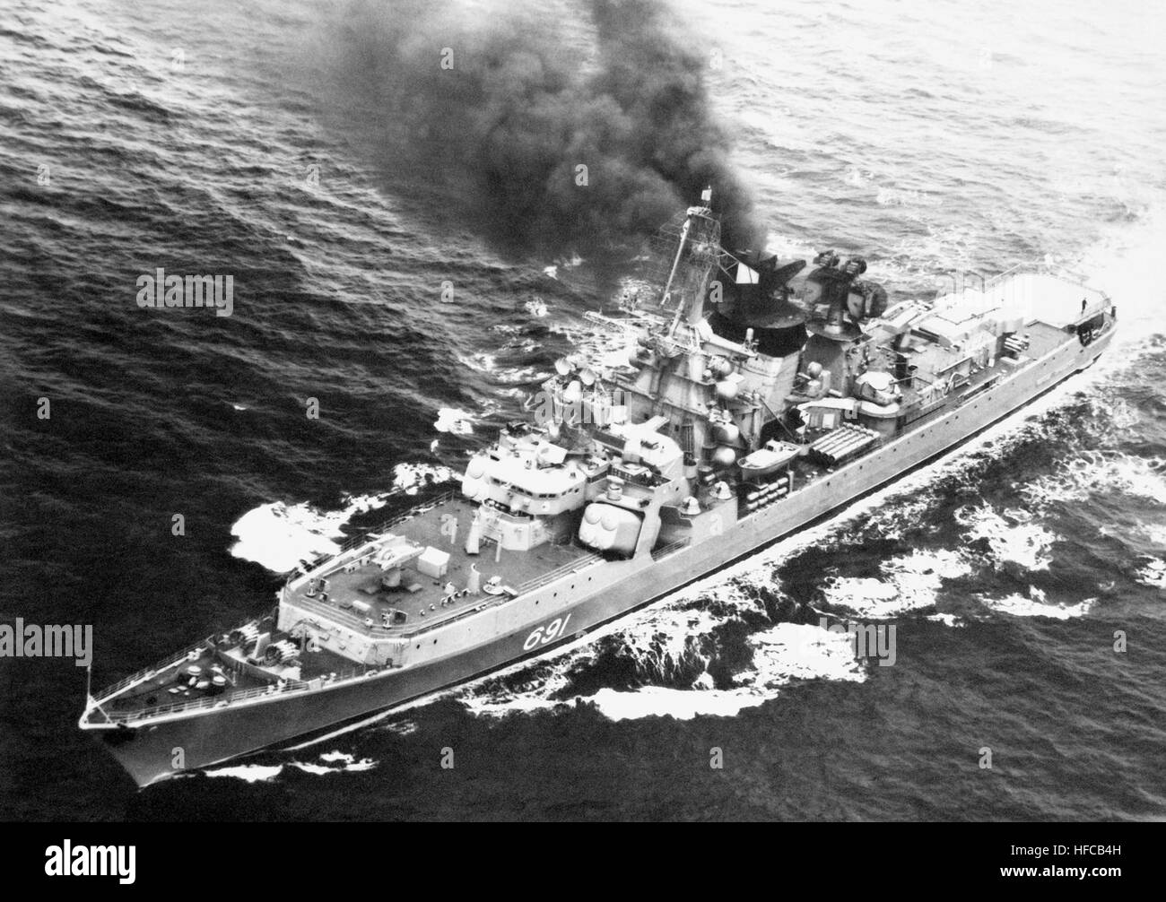 An elevated port bow view of a Soviet Kresta II class guided missile