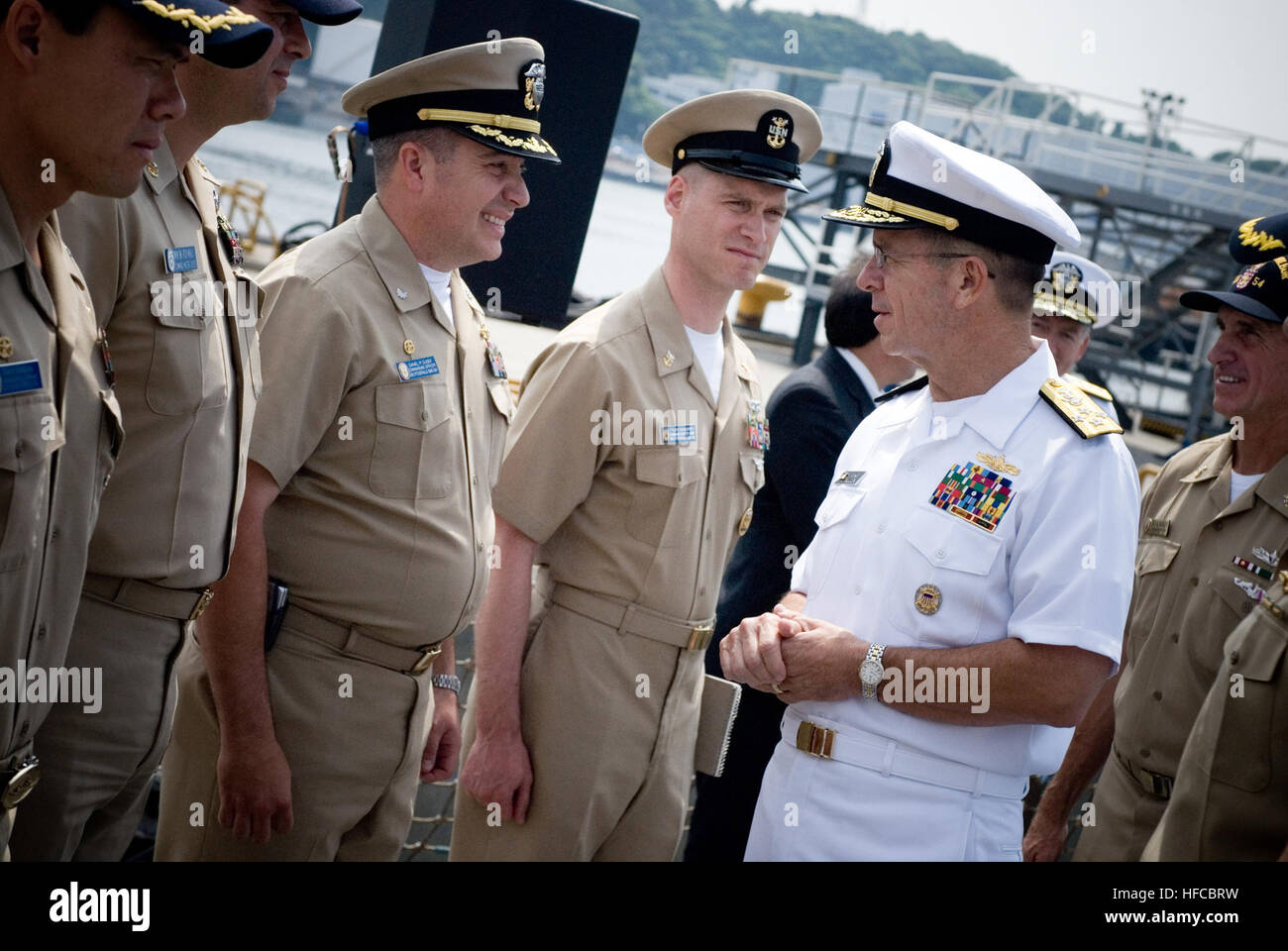 Chief of Naval Operations (CNO) Adm. Mike Mullen greets commanding officers and command master chiefs aboard USS Curtis Wilbur (DDG 54) during an visit to U.S. Fleet Activities, Yokosuka, Japan. Mullen is on a seven-day trip to Japan and Vietnam to visit with counterparts and with Sailors stationed in the region. (U.S. Navy photo by Mass Communication Specialist 1st Class Chad J. McNeeley) Meet and Greet 49496 Stock Photo