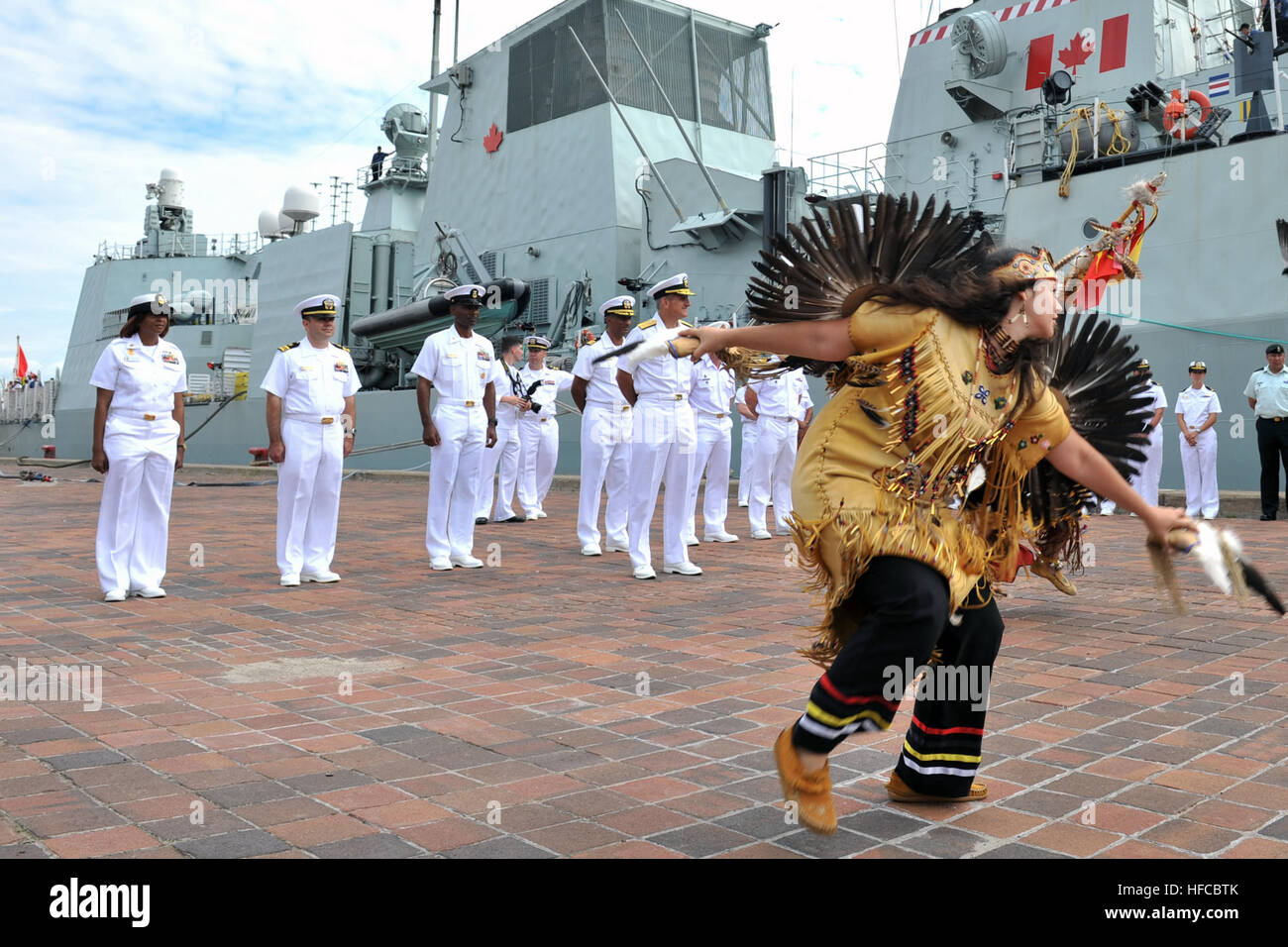 120726-N-YZ751-113 QUEBEC CITY (July 26, 2012) Melenie Savard, a member of the Wendake First Nation, performs a traditional dance for Rear Adm. Gregory M. Nosal, commander of Carrier Strike Group (CSG) 2, and American and Canadian sailors during a welcoming ceremony in front of the Canadian Halifax-class frigate HMCS Ville de Quebec (FFH 332). Ville de Quebec, the Oliver Hazard Perry-class frigate USS DeWert (FFG 45), and the Cyclone-class coastal patrol ship USS Hurricane (PC 3) are visiting cities in America and Canada to celebrate the Bicentennial of the War of 1812. (U.S. Navy photo by Mas Stock Photo