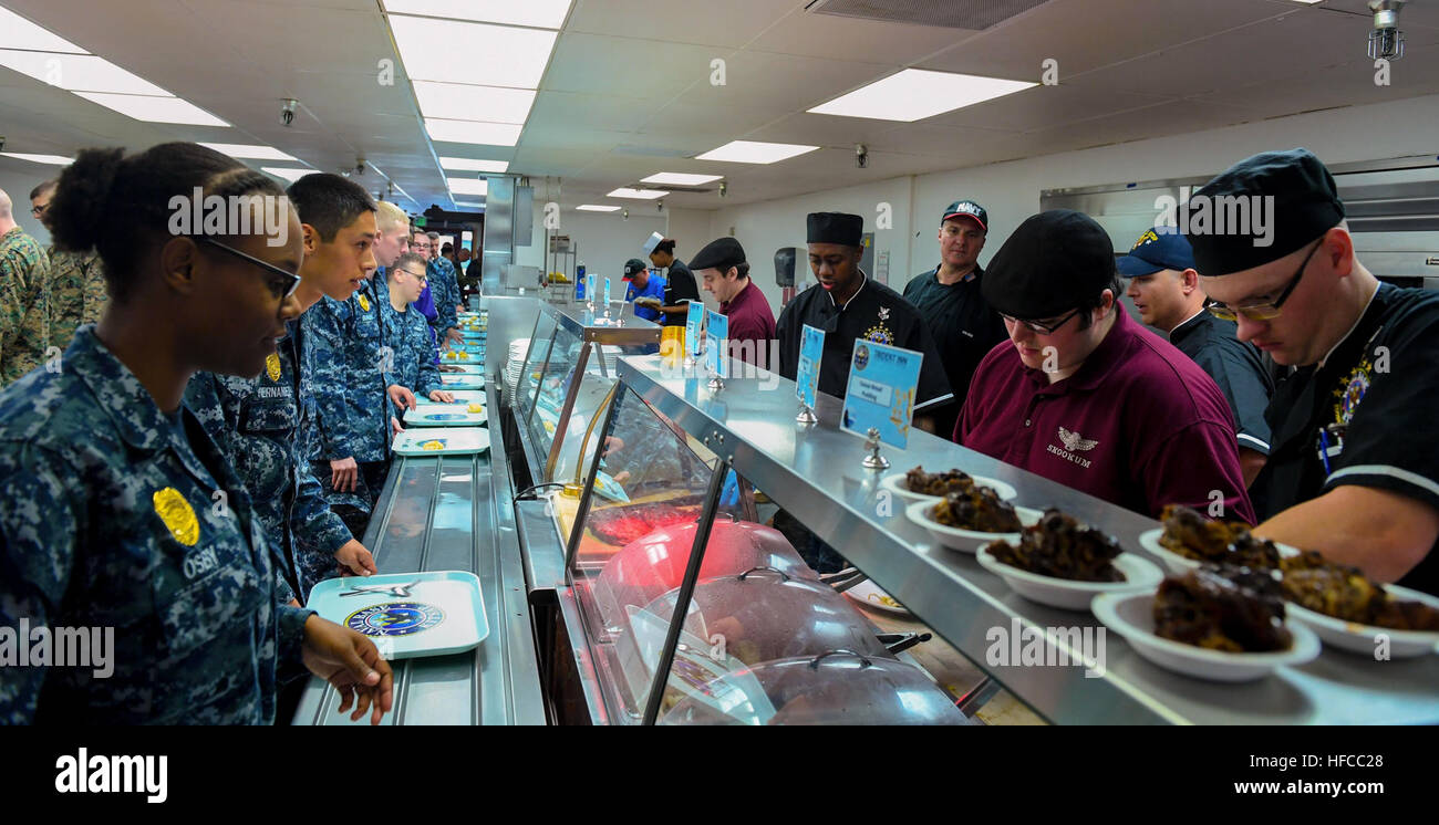 160921-N-SH284-182 SILVERDALE, Wash. (Sept. 21, 2016) – Celebrity chef Pete Blohme, also known as 'Panini Pete' supervises meal service as lunch is served to Sailors during a Mess Lords event at Naval Base Kitsap-Bangor's Trident Inn Galley. The event, hosted by Navy Entertainment, included Blohme, Celina Tio from her Kansas City  restaurant Julian, and Voula's Offshore's Sikey Vlahos. The chefs, collectively known as the 'Mess Lords', have been featured on popular cooking shows like Food Network’s “The Next Iron Chef” and 'Diners, Drive-ins and Dives.' (U.S. Navy photo by Mass Communication S Stock Photo