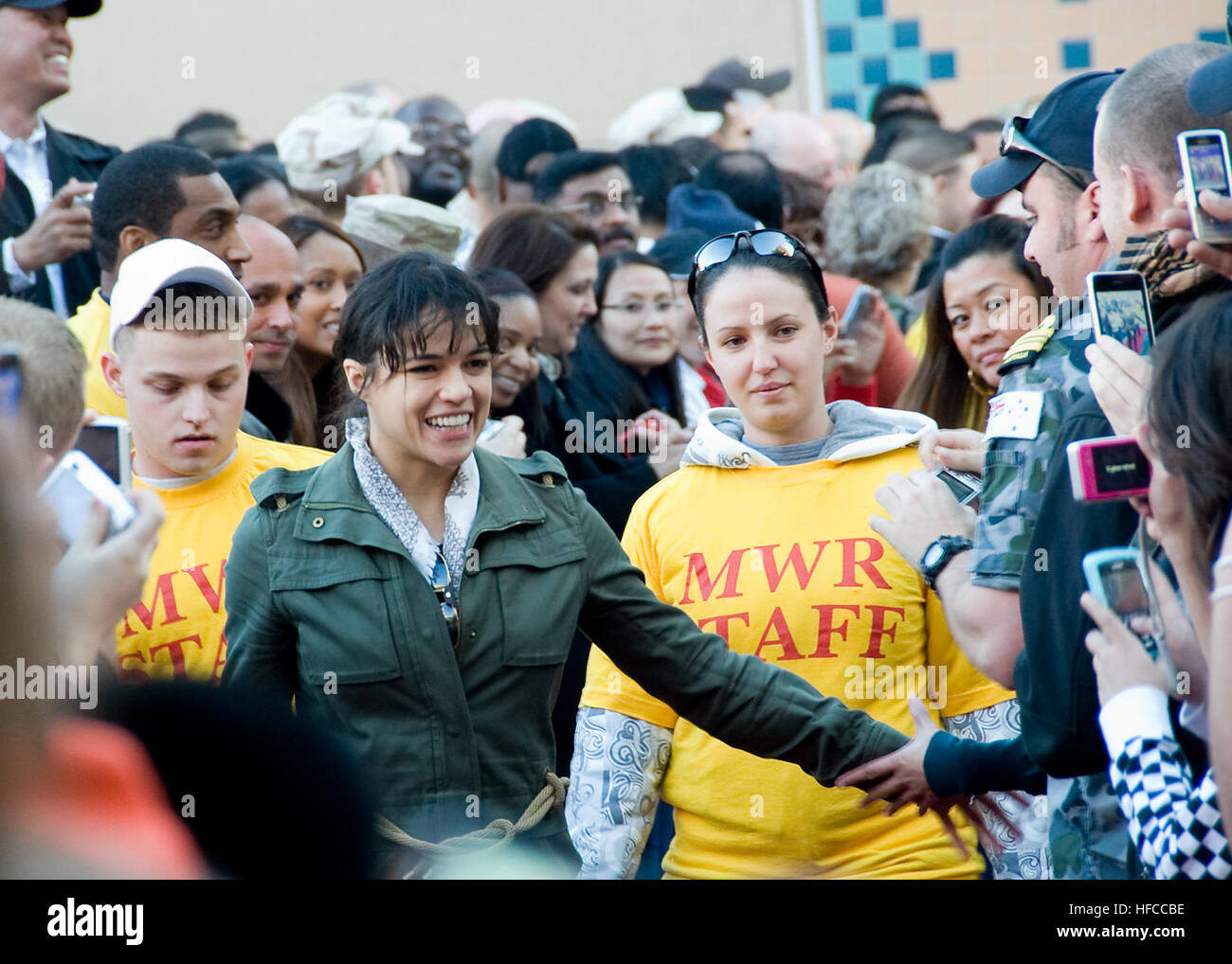 Michelle Rodriguez, an actress from the science fiction film Avatar, meets with U.S. Sailors and their families during a meet and greet event on Naval Support Activity Bahrain in Manama, Bahrain, Jan. 28, 2010. The stop, which is one of several planned in the U.S. 5th Fleet area of operations, includes Avatar stars Sigourney Weaver, Stephen Lang and Oscar-winning director James Cameron. (DoD photo by Mass Communication Specialist 2nd Class Aramis X. Ramirez, U.S. Navy/Released) Michelle Rodriguez at NSA Bahrain 2010-01-28 Stock Photo