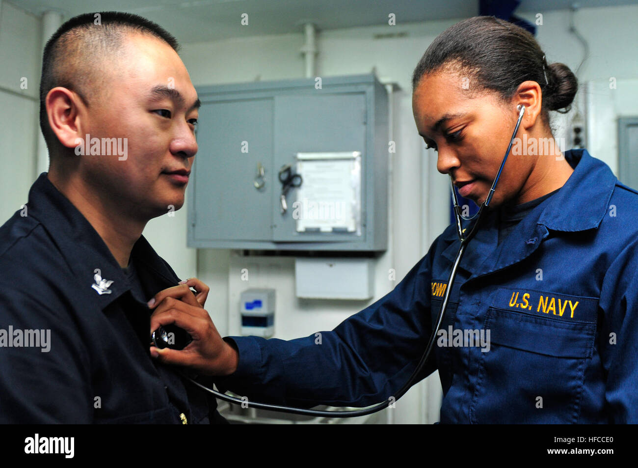 Midshipman 3rd Class Alexis Brown, right, practices checking the vitals