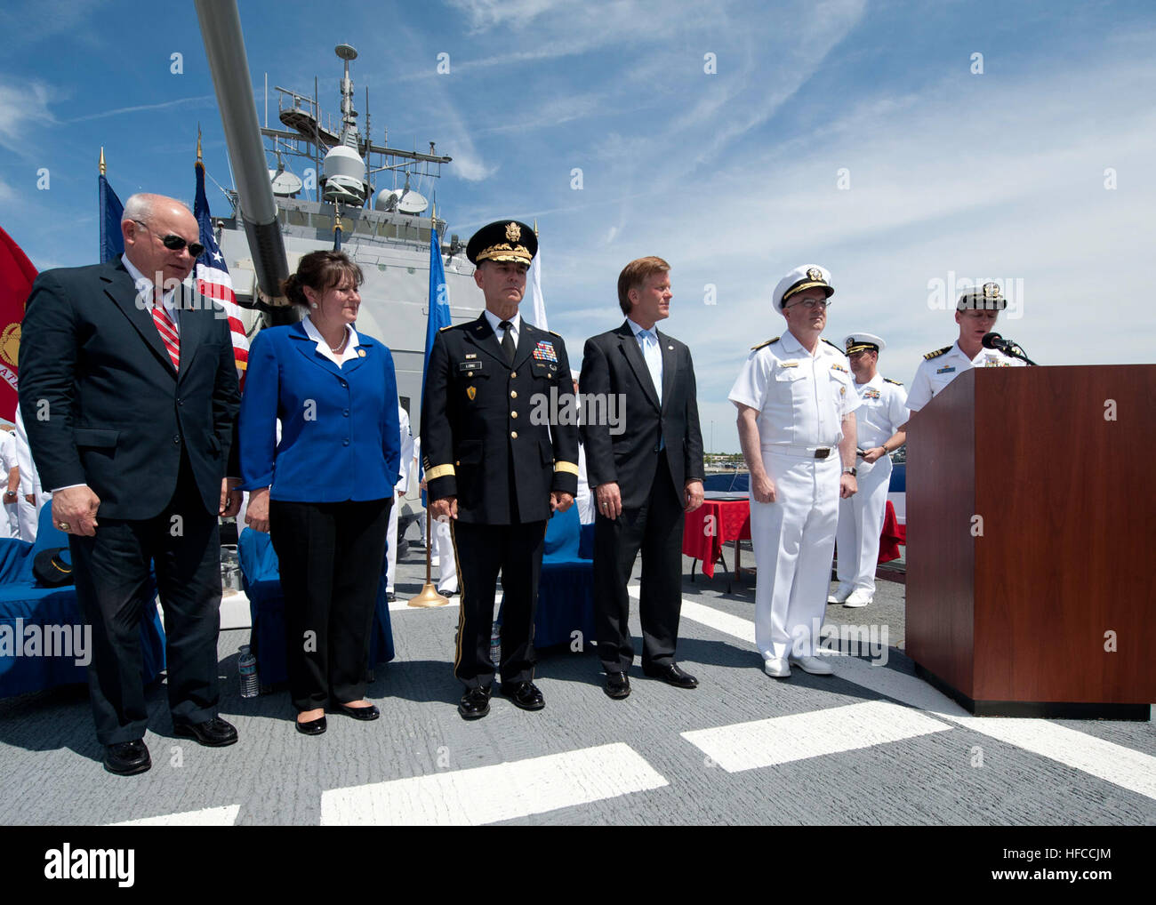 Capt. Mary Jackson, right, commander of Naval Station Norfolk, reads a