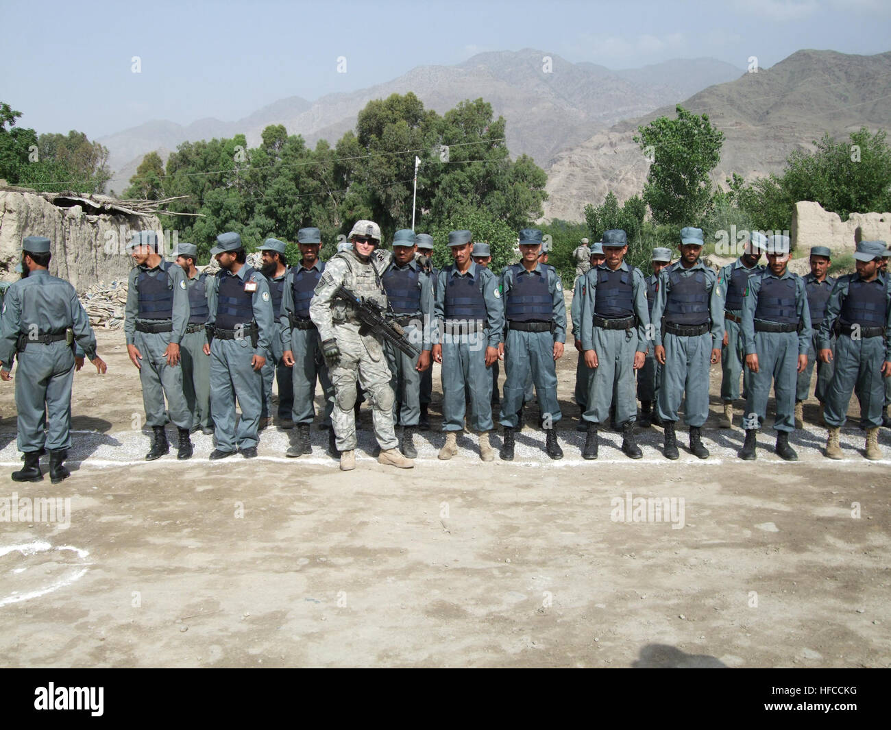 Sgt. Nathan Byrd attending an Afghan national police graduation ceremony in Sarkani. Military Police Making a Difference in Security for Konar Province 113864 Stock Photo