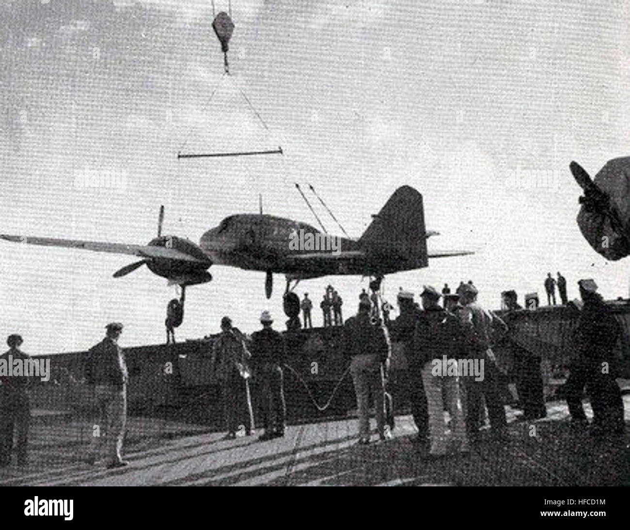 Mitsubishi Ki-46 is loaded on USS Attu (CVE-102) 1944 Stock Photo