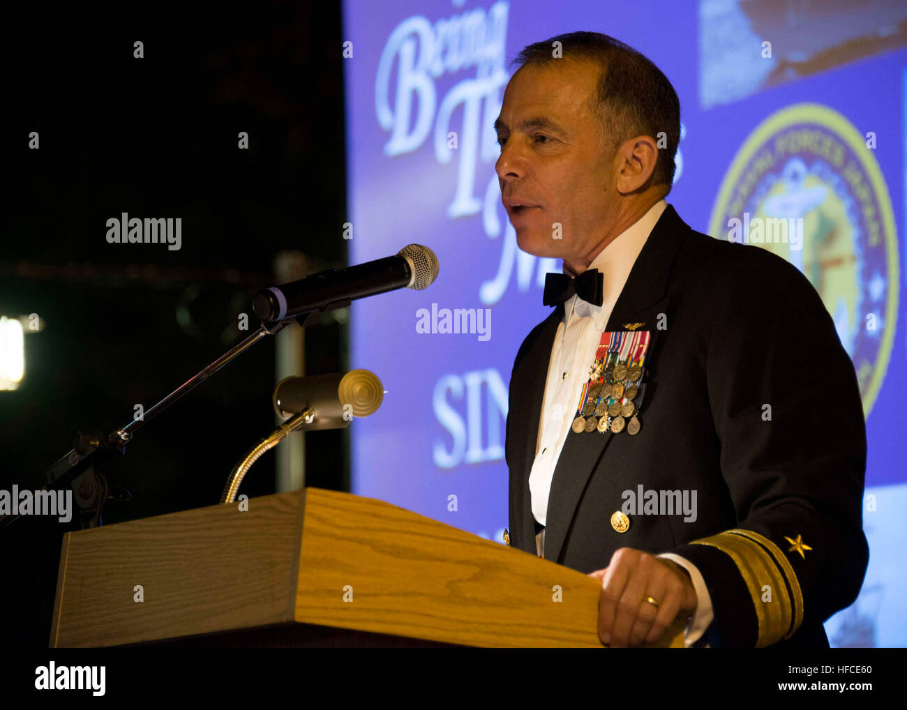 Commander, U.S. Naval Forces Japan Rear Adm. Terry Kraft addresses attendees as the special