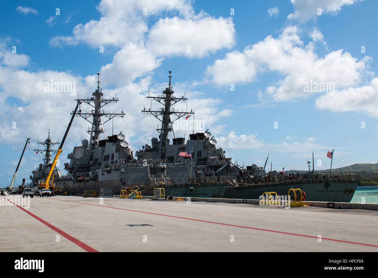 APRA HARBOR, Guam (March 4, 2016) – The destroyers USS McCampbell (DDG-85), Curtis Wilbur (DDG-54) and USS Benfold (DDG-65) take position next to one another on Sierra Wharf, Apra Harbor, U.S. Naval Base Guam for a short in-port period prior to the bilateral exercise Multi-Sail 2016 (MS-16).  Ten total naval surface combatants assigned to the U.S. and Japanese navies arrived in-port to Apra Harbor, increasing the total number of visiting and home-ported vessels at the base to 20 and marked the largest contingent of vessels in Apra Harbor in more than 30 years. (Released/Jeff Landis, Major, USM Stock Photo
